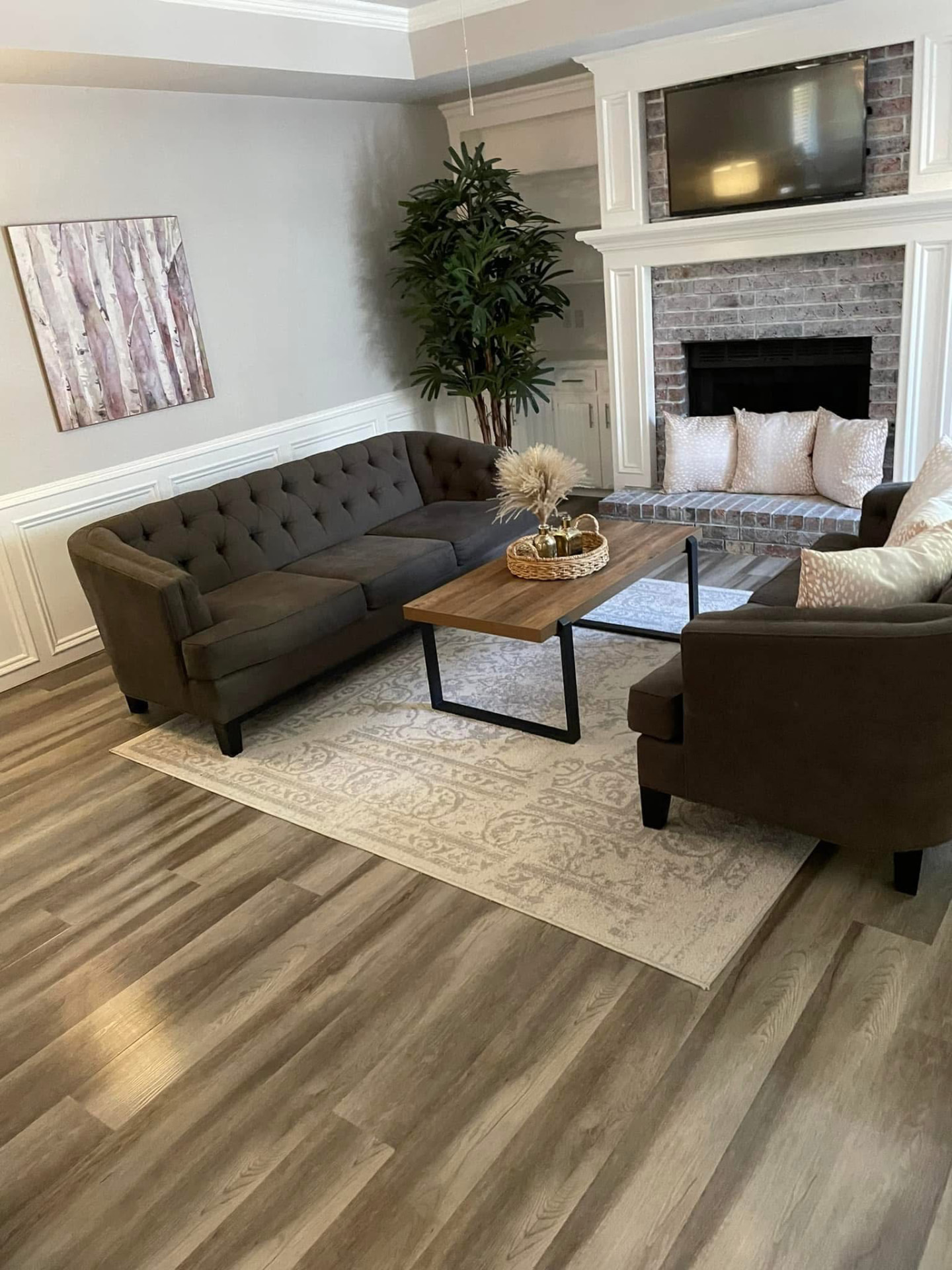 Freshly cleaned living room with polished floors by Forever Family Cleaning Service LLC